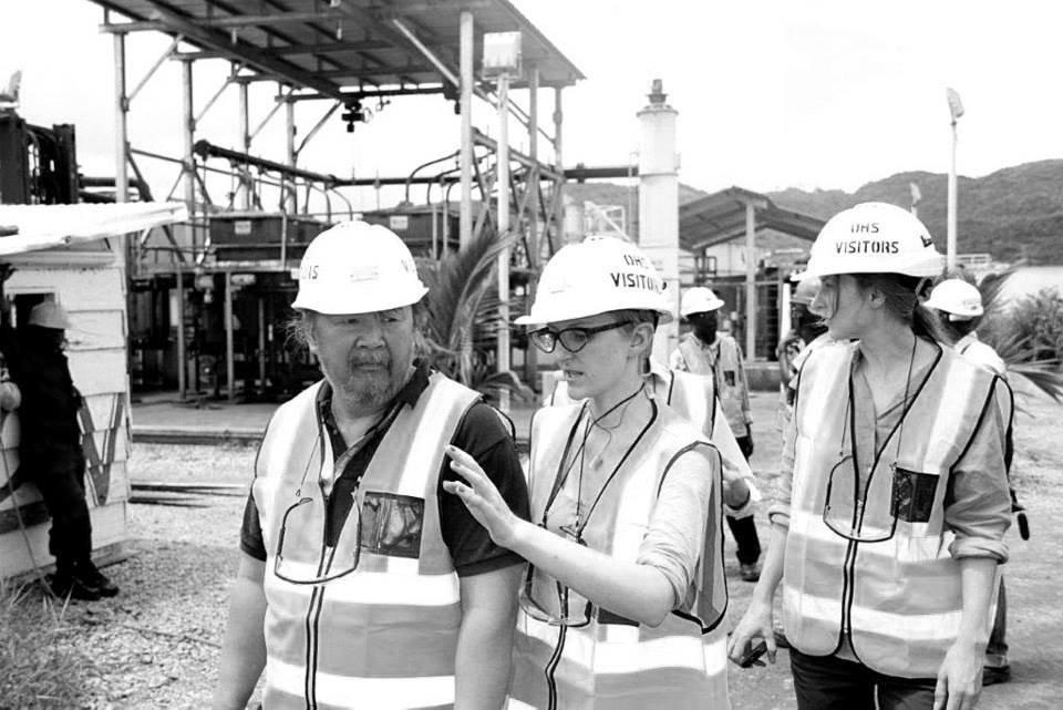 Susan Isko interpreting on site at the Ashanti gold mines, in hard hat and hi-vis vest