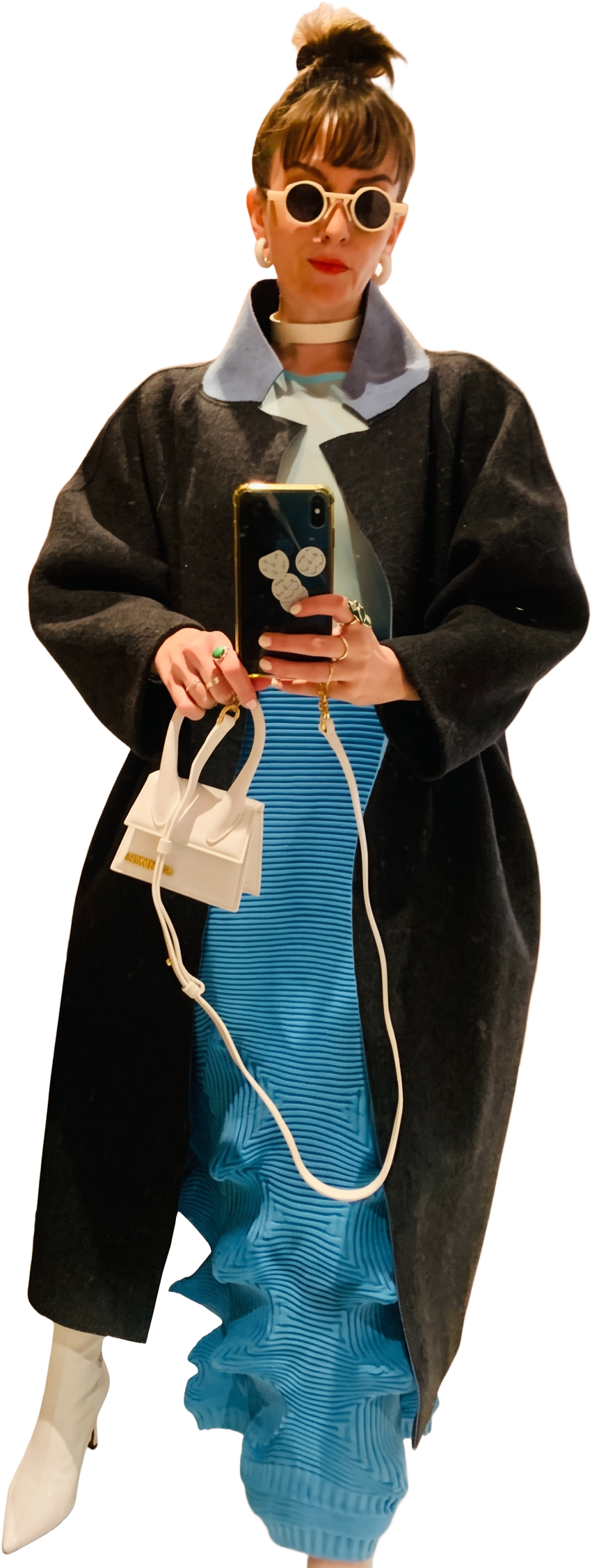 Oversized grey coat over a blue pleated skirt